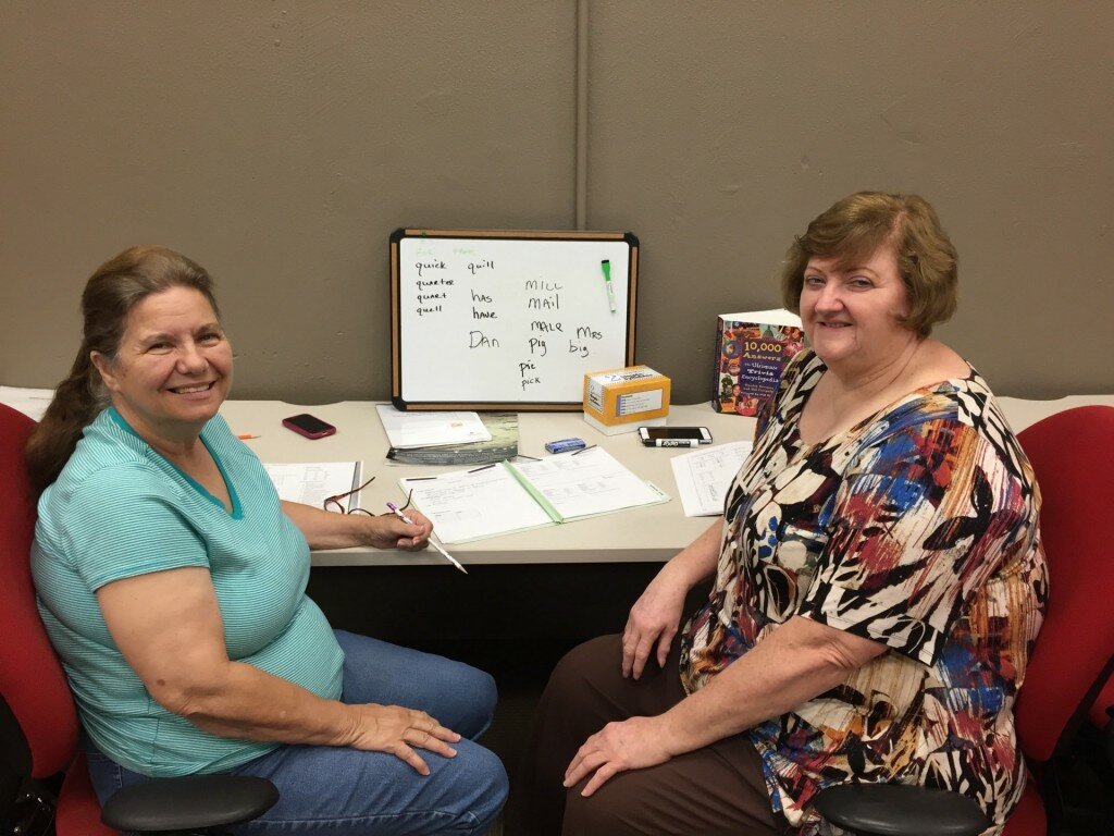 Learner Janie Morgan, left, and volunteer tutor Judy Hickman take a quick break from lessons at the Literacy Council in downtown Birmingham. Credit: Dan Carsen / WBHM